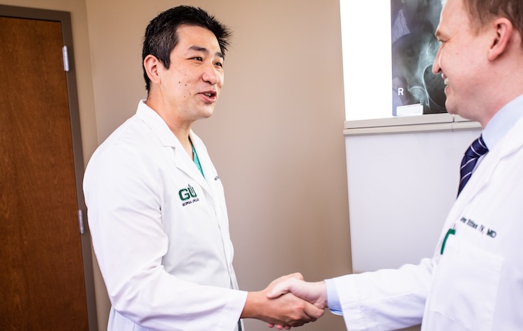 Two Georgia Urology Drs Shaking Hands