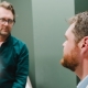 Dr. Kemper having discussion with patient in examination room