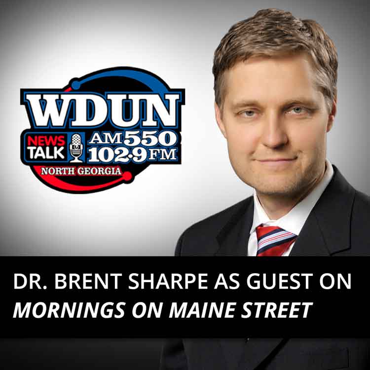 Dr. Brent Sharpe with WDUN logo