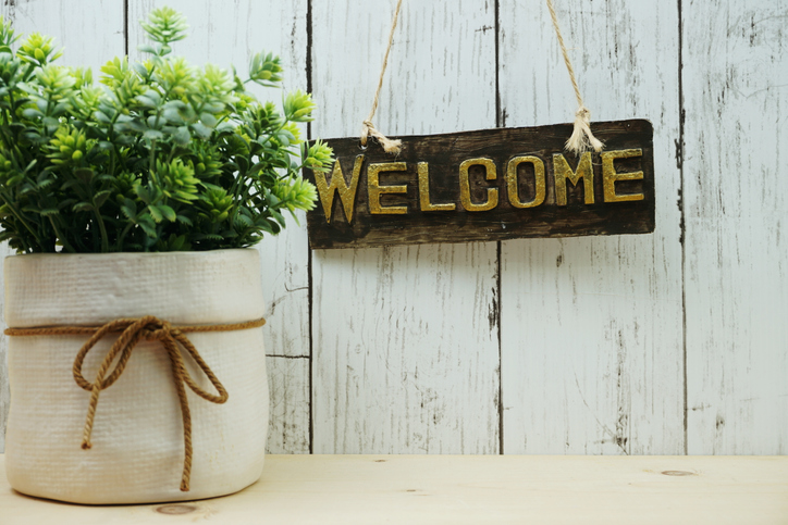 Welcome sign and home decor with space copy background.