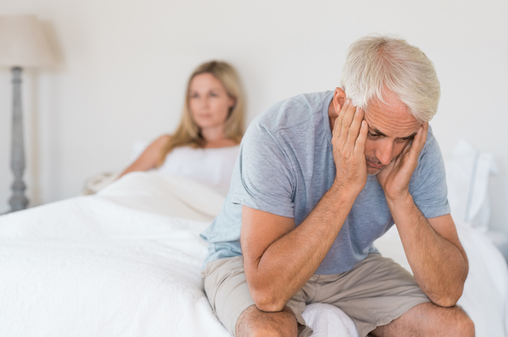 Upset mature couple ignoring each other. Close up of a worried senior man in tension at bed. Senior couple angry with each other after a fight after dealing with erectile dysfunction.