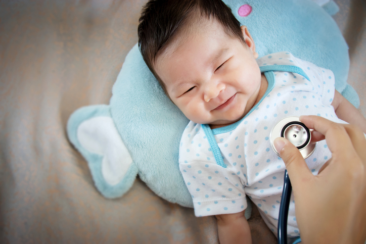 healthy people concept. Asian adorable baby infant laughing with happy face for good health on doctor check up timePeople visiting to check out undescended testis.