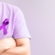 Person wearing a purple ribbon
